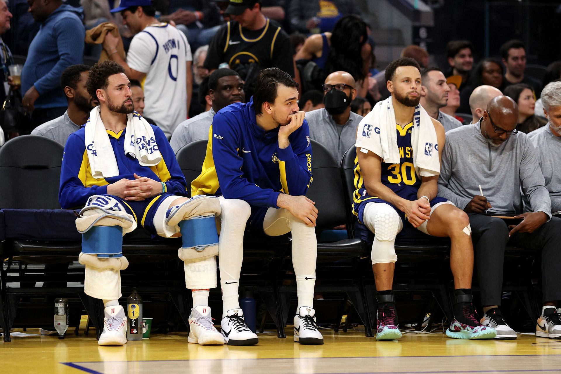 The Golden State Warriors looking dejected on the bench.