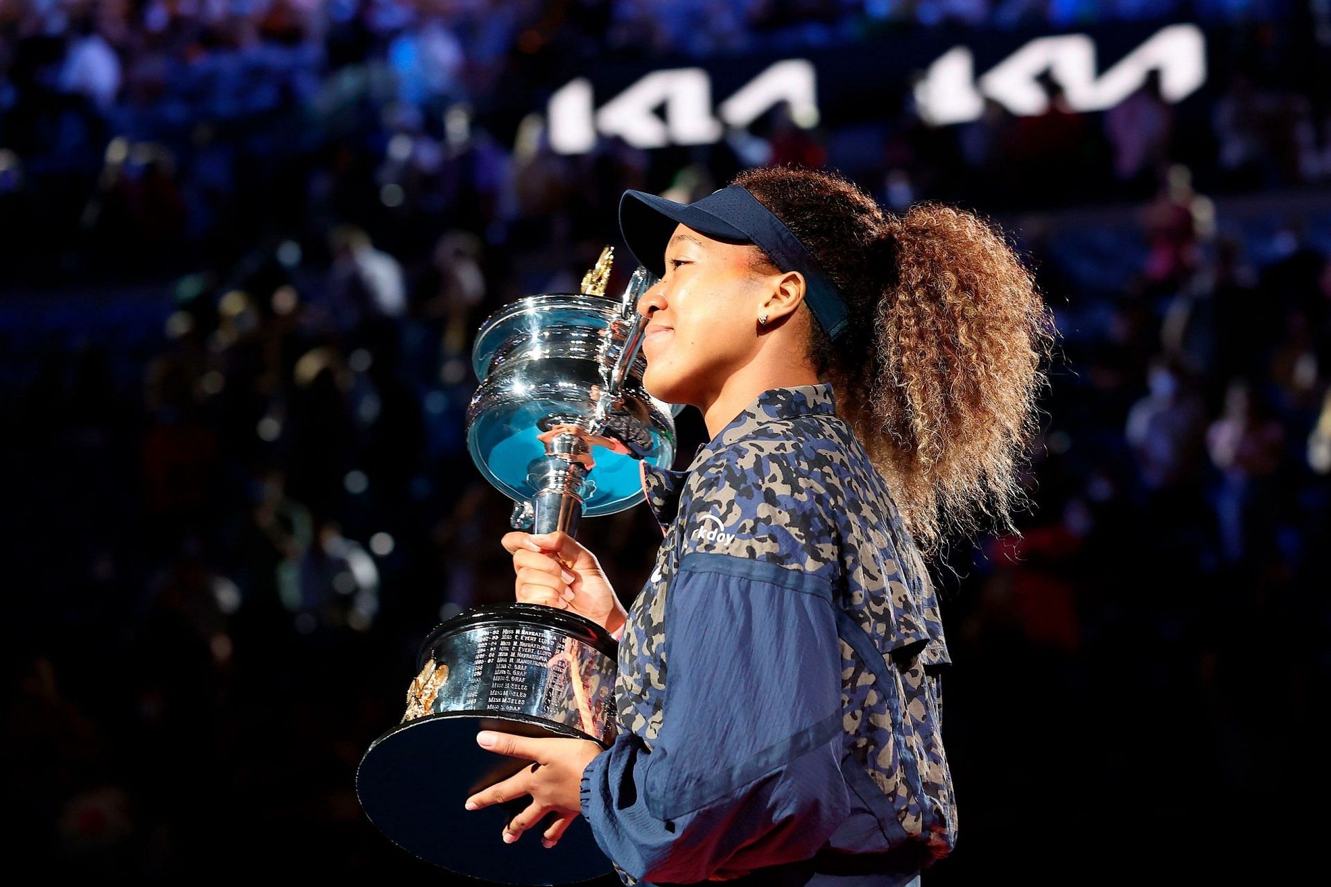 Naomi Osaka poses with the 2021 Australian Open trophy