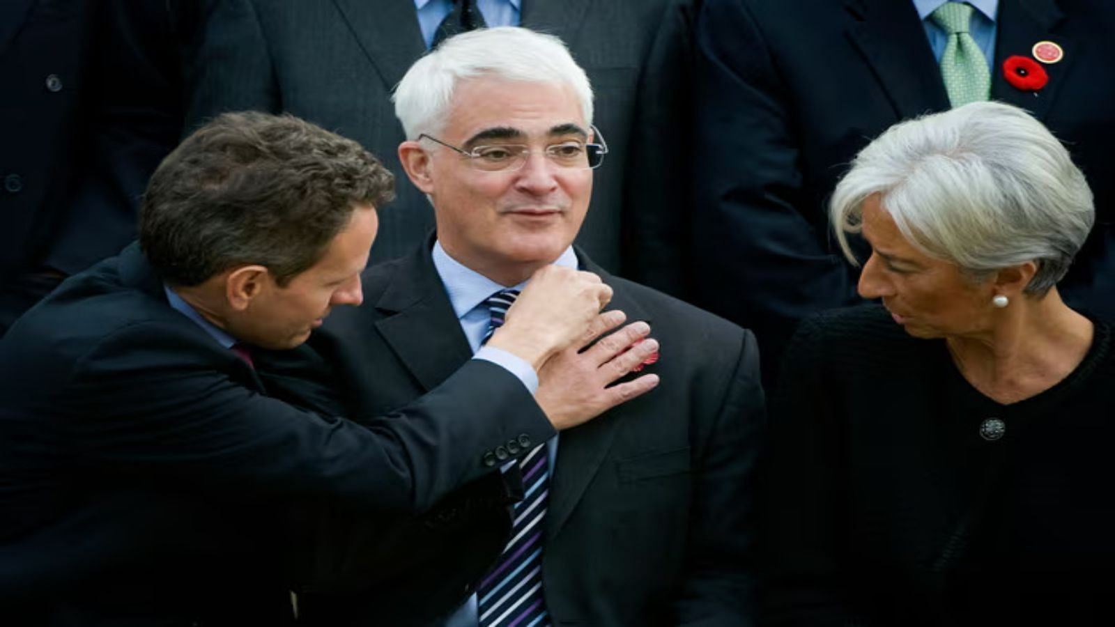 US Treasury Secretary Timothy Geithner, left, adjusts Alistair Darling&rsquo;s collar (Image via X / Chris Clarke)