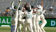 Australian players rejoice in Nathan Lyon's 500th Test wicket.