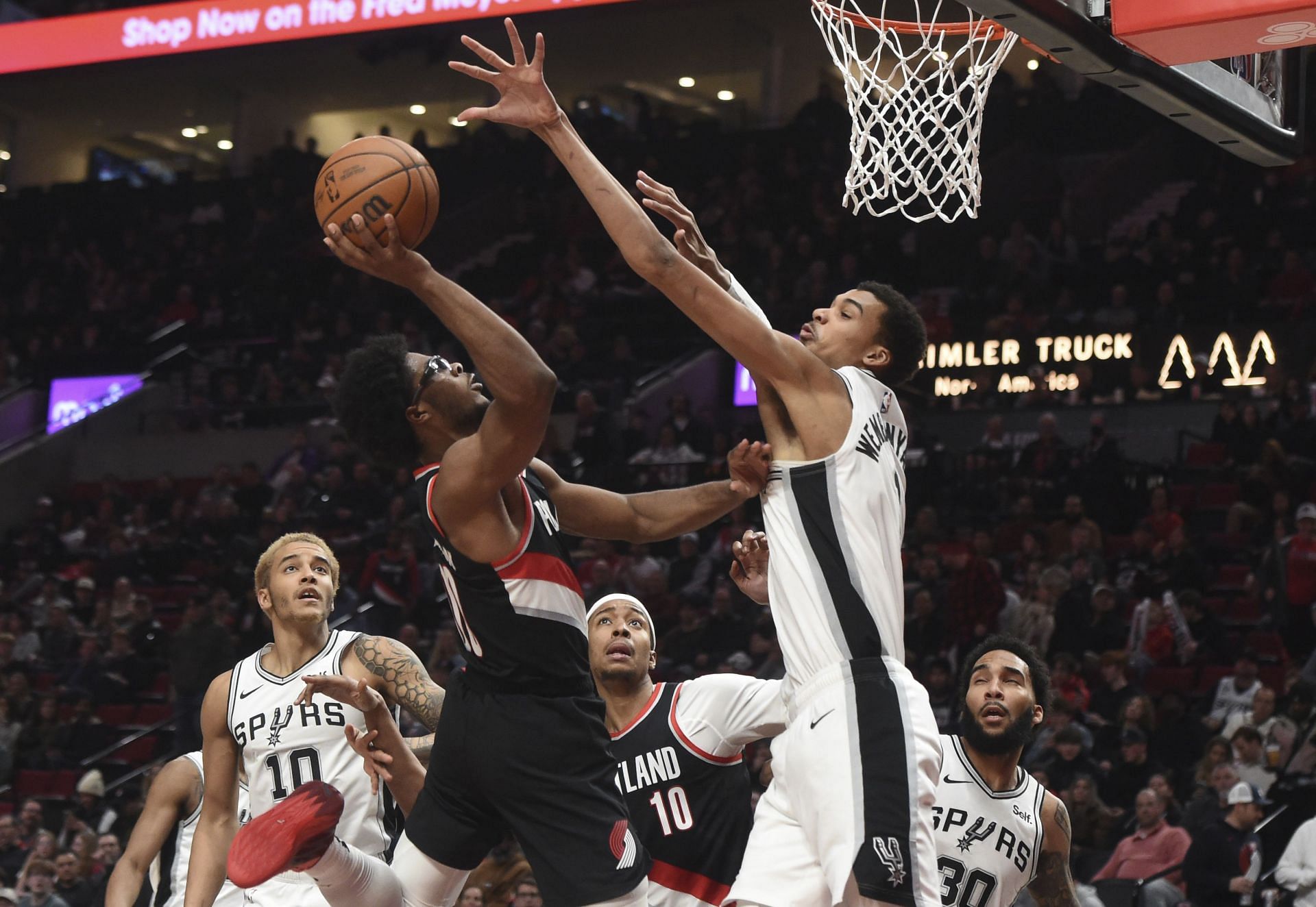 Scoot Henderson of the Portland Trail Blazers against Victor Wembanyama of the San Antonio Spurs