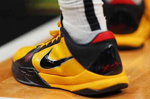 Caitlin Clark wearing the Nike Kobe 5 Protro "Bruce Lee" colorway