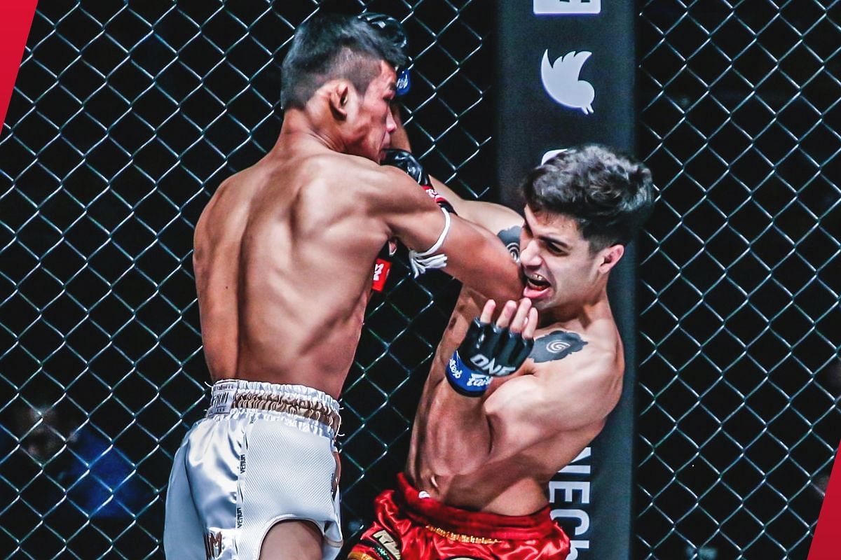 Superlek lands a big right elbow on Rui Botelho [Photo via: ONE Championship]