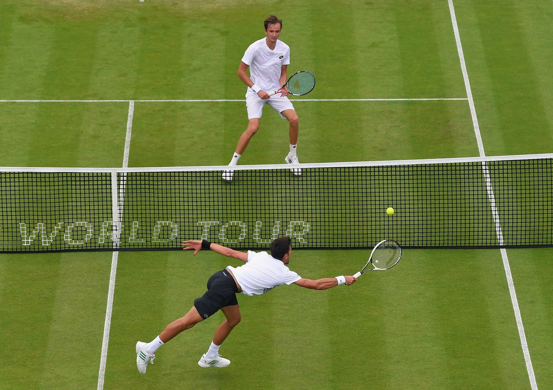 Novak Djokovic hits a return against Daniil Medvedev