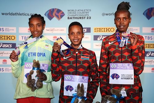 Tsigie Gebreselama (left), Beatrice Chebet (center), and Agnes Ngetich (right) at the 2023 World Cross Country Championships in Bathurst, Australia. (Photo by Cameron Spencer/Getty Images for World Athletics )