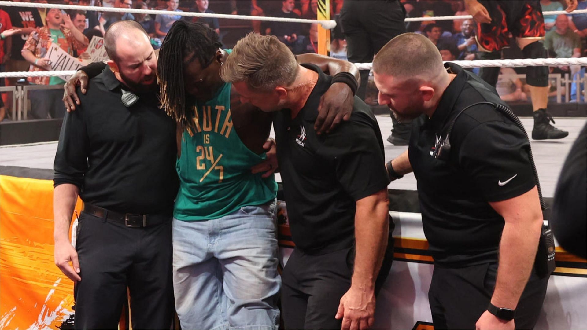 R-Truth is taken to the back after the quad injury he suffered during match against Grayson Waller.