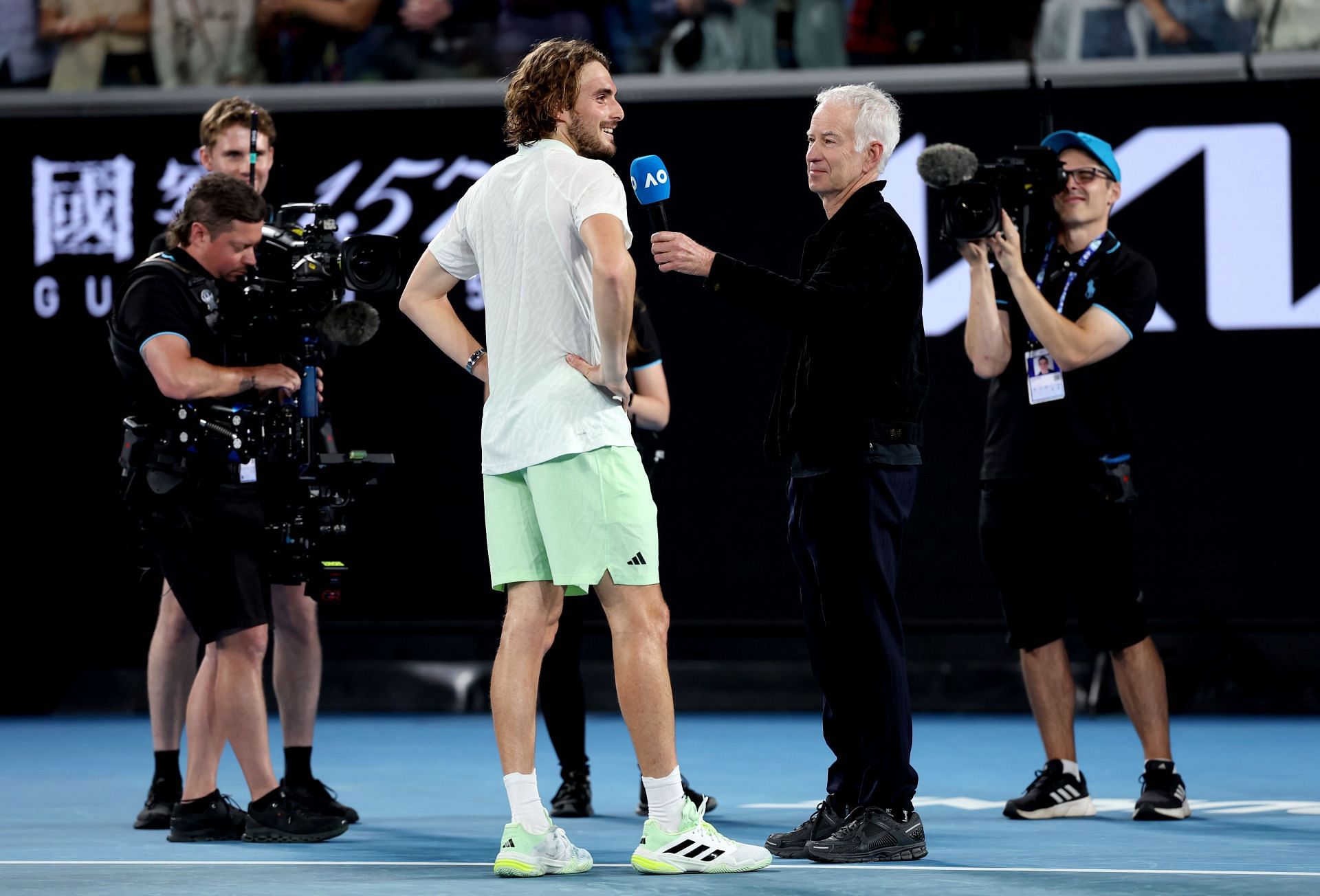 John McEnroe interviewing Stefanos Tsitsipas at Australian Open 2024