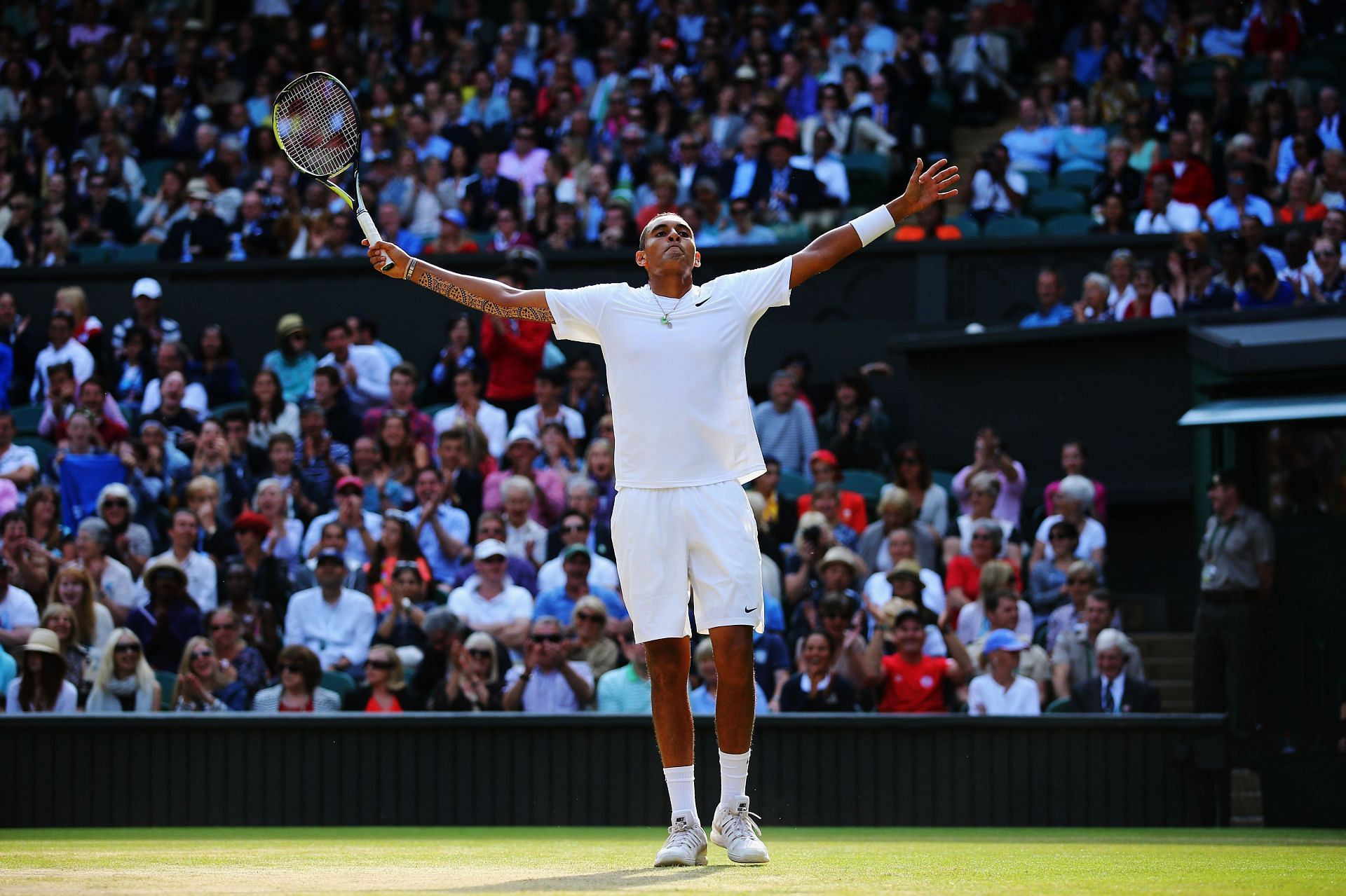 Nick Kyrgios celebrates against Rafael Nadal at Wimbledon 2014