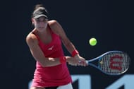 Oceane Dodin plays a backhand against Lin Zhu