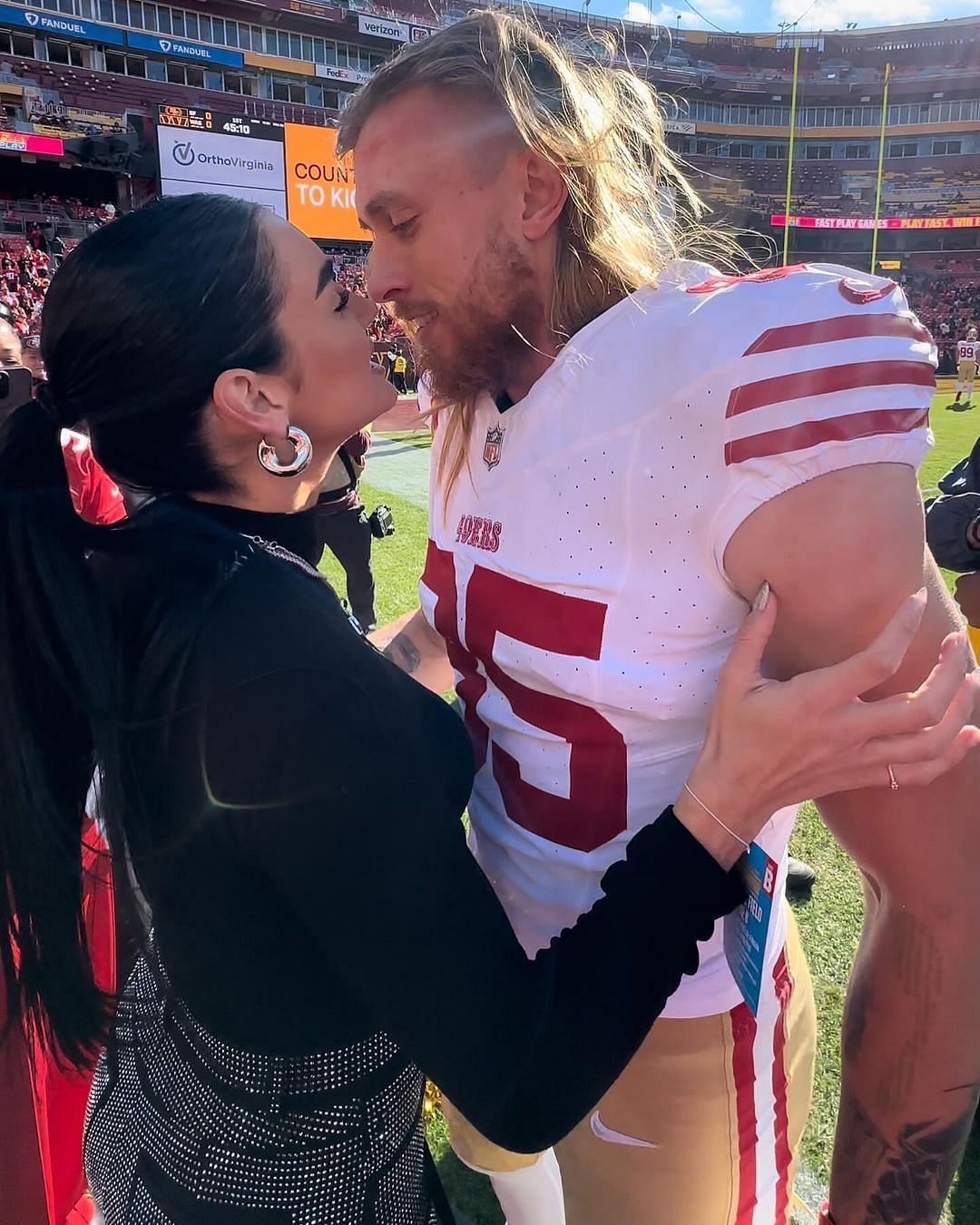 Claire with her husband George at the 49ers - Commanders game (@clairekittle/IG)