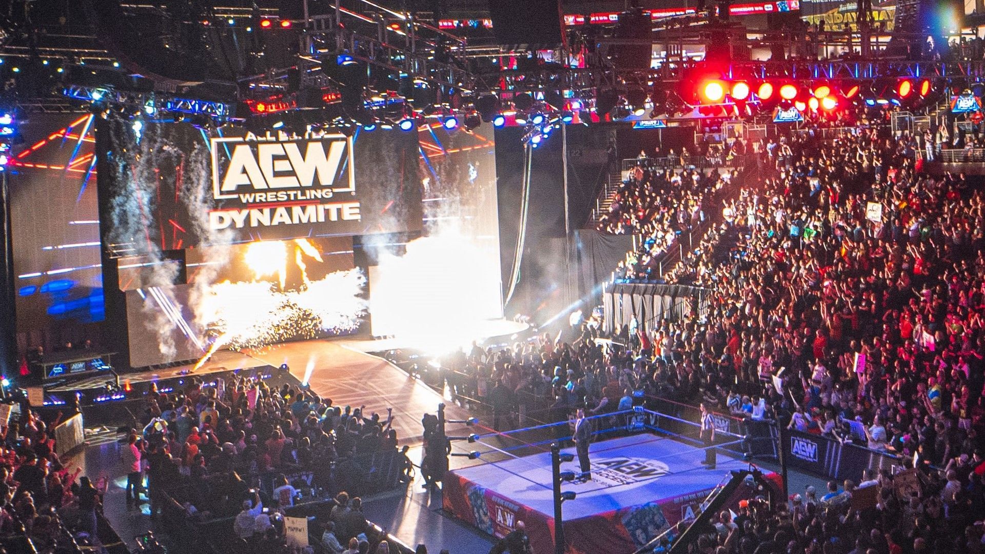 The AEW Dynamite ring and stage/set with a packed crowd.