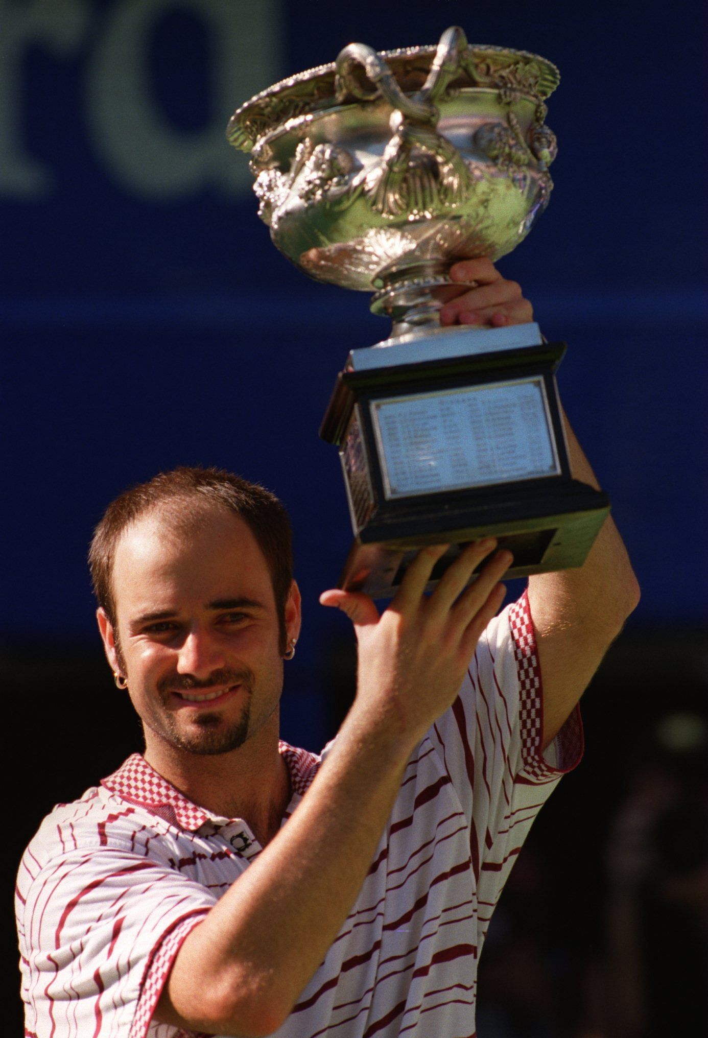 Andre Agassi with the 1995 Australian Open trophy