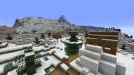 The frigid mountains near this seed's village contain a dark secret (Image via Mojang Studios)