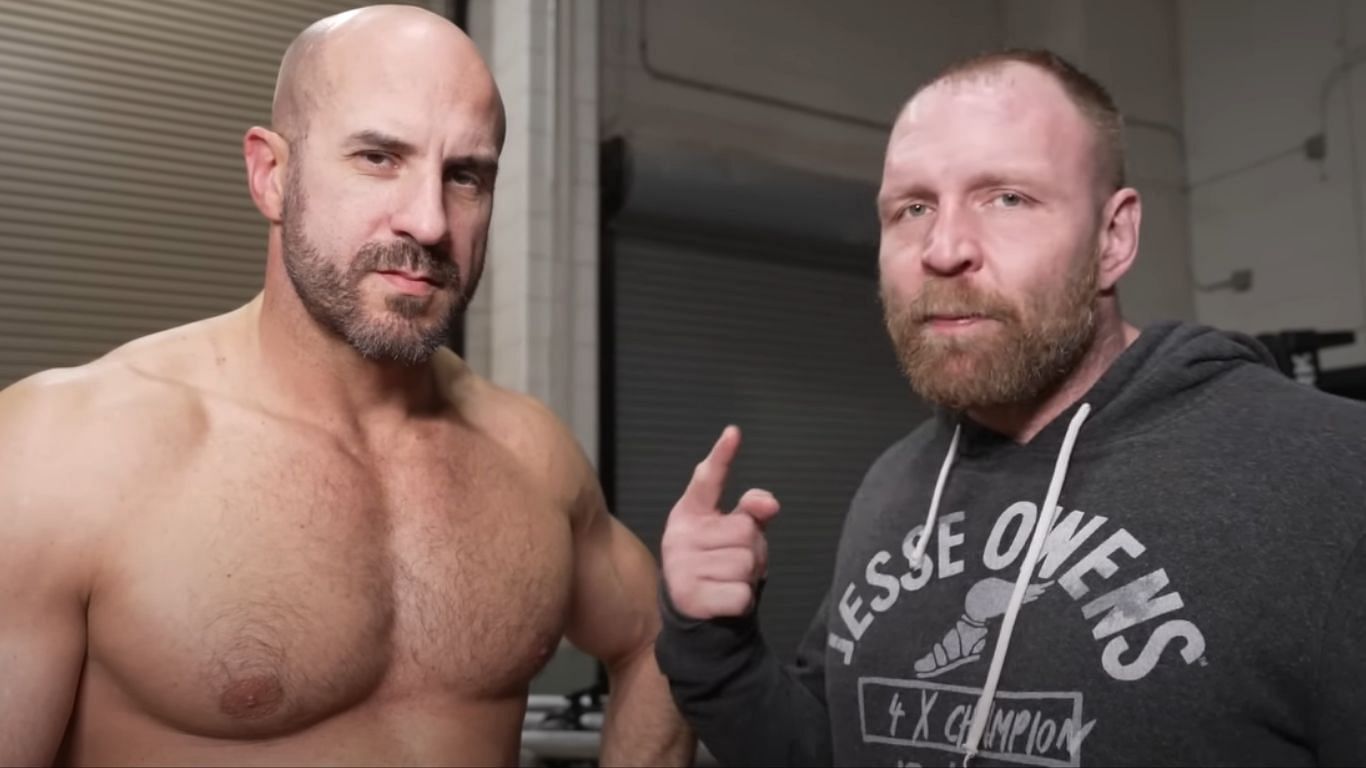 Claudio Castagnoli (left), Jon Moxley (right)