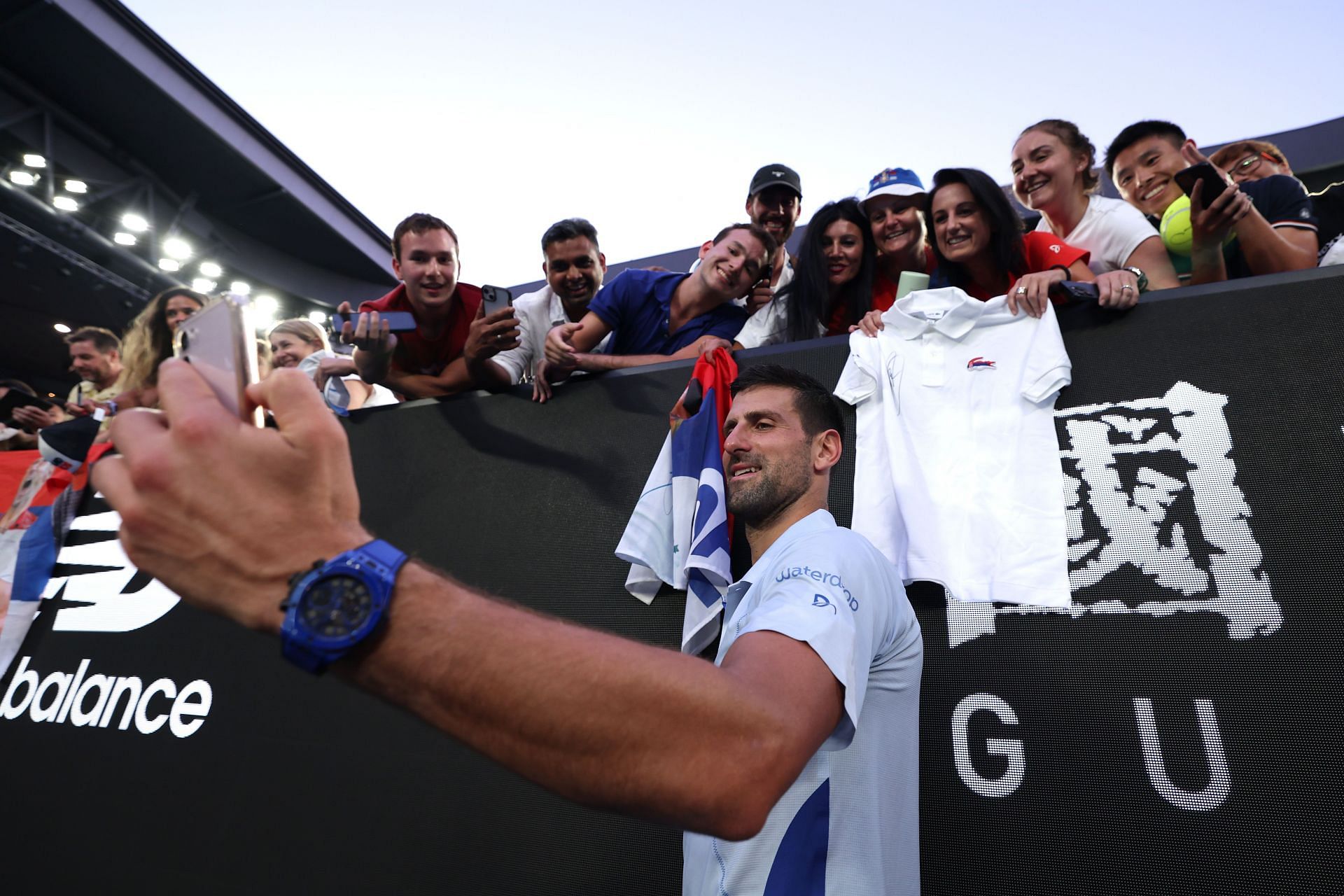 Novak Djokovic pictured with fans at the 2024 Australian Open