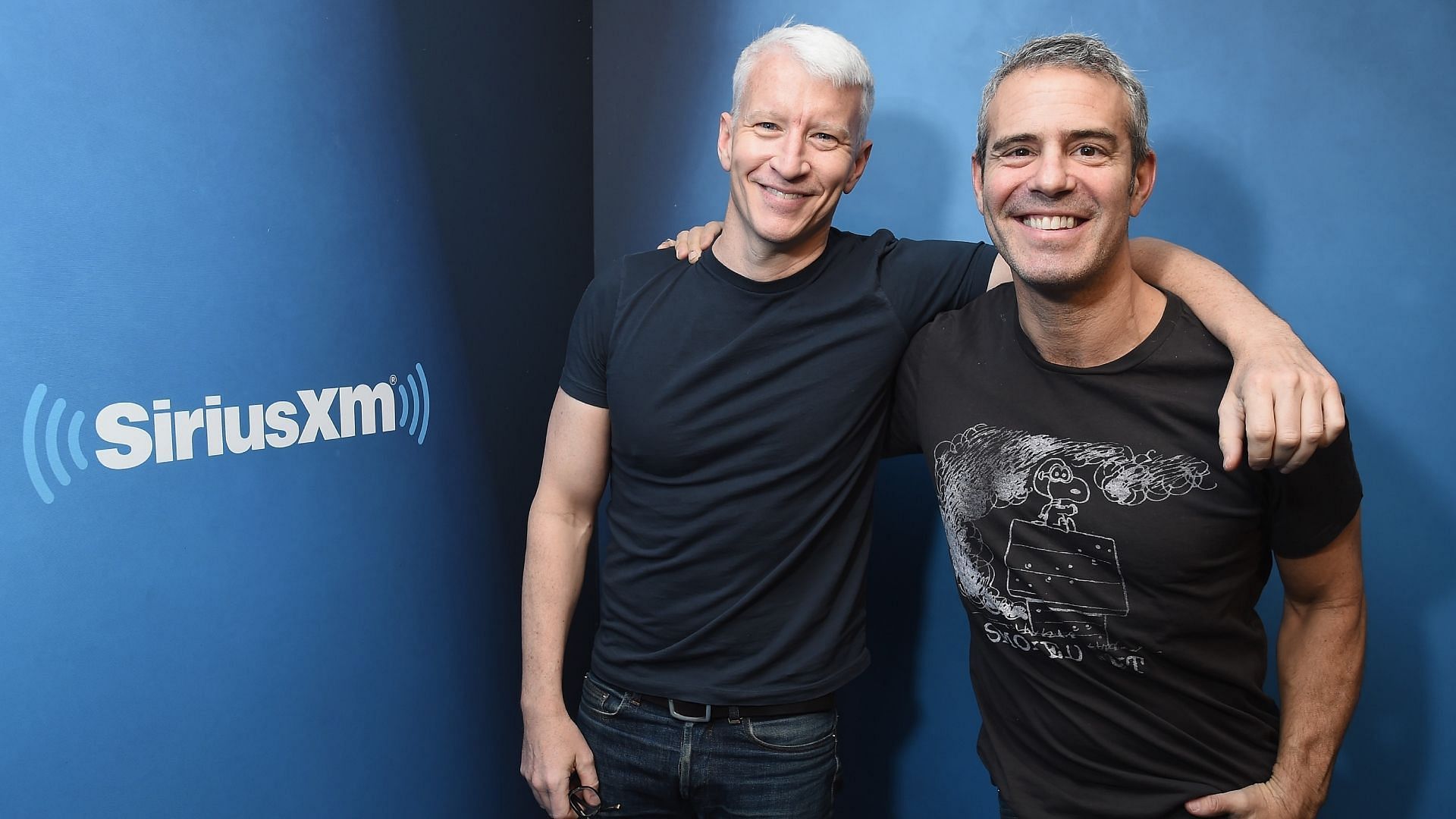 Anderson Cooper and Andy Cohen net worth. (Image via Getty)