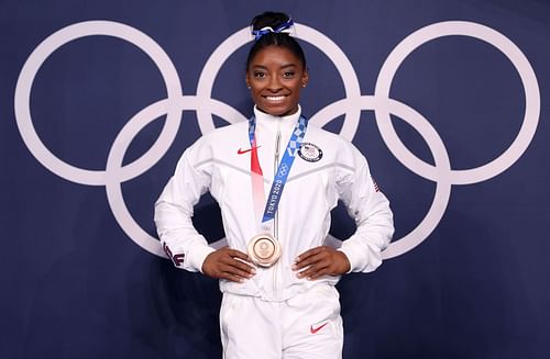 Simone Biles of Team United States poses with the bronze medal following the Women's Balance Beam Final at the 2020 Olympic Games in Tokyo, Japan.