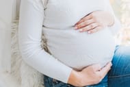 Lifting weights during pregnancy (Image via Unsplash/Anastasiia Chepinska)