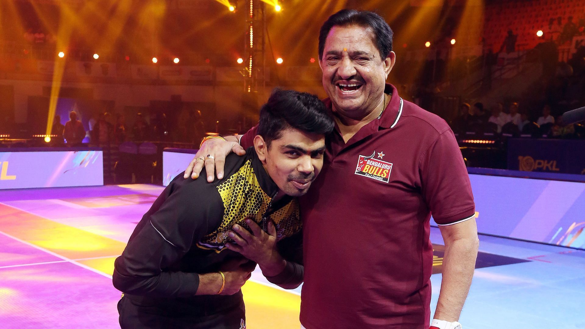 Pawan Sehrawat of Telugu Titans with Bengaluru Bulls coach Randhir Sehrawat (Image via PKL)