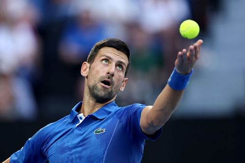 Novak Djokovic serves during his first round match at the Australian Open 2024