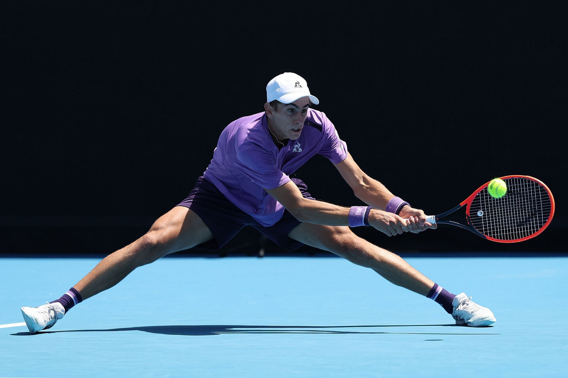 Matteo Arnaldi plays a backhand against Adam Walton