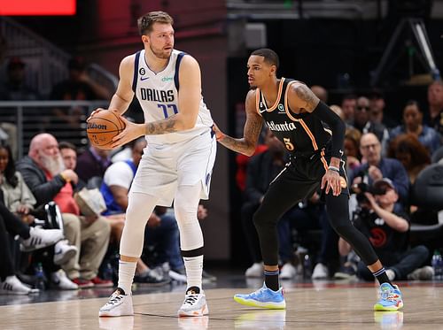 Atlanta Hawks guard Dejounte Murray guarding Dallas Mavericks guard Luka Doncic