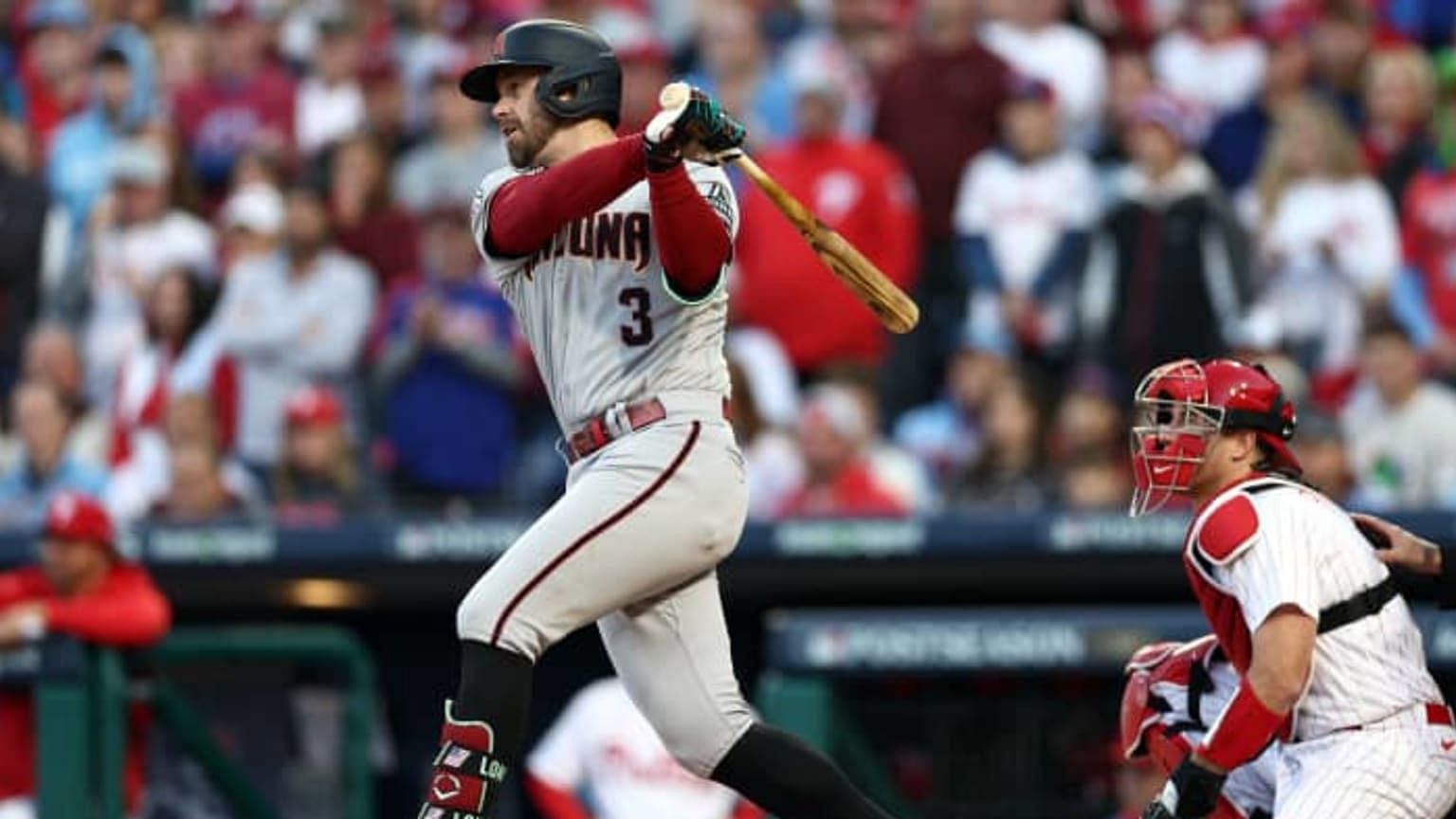 Evan Longoria hits an RBI double for the D-Backs in a regular-season game against the Phillies