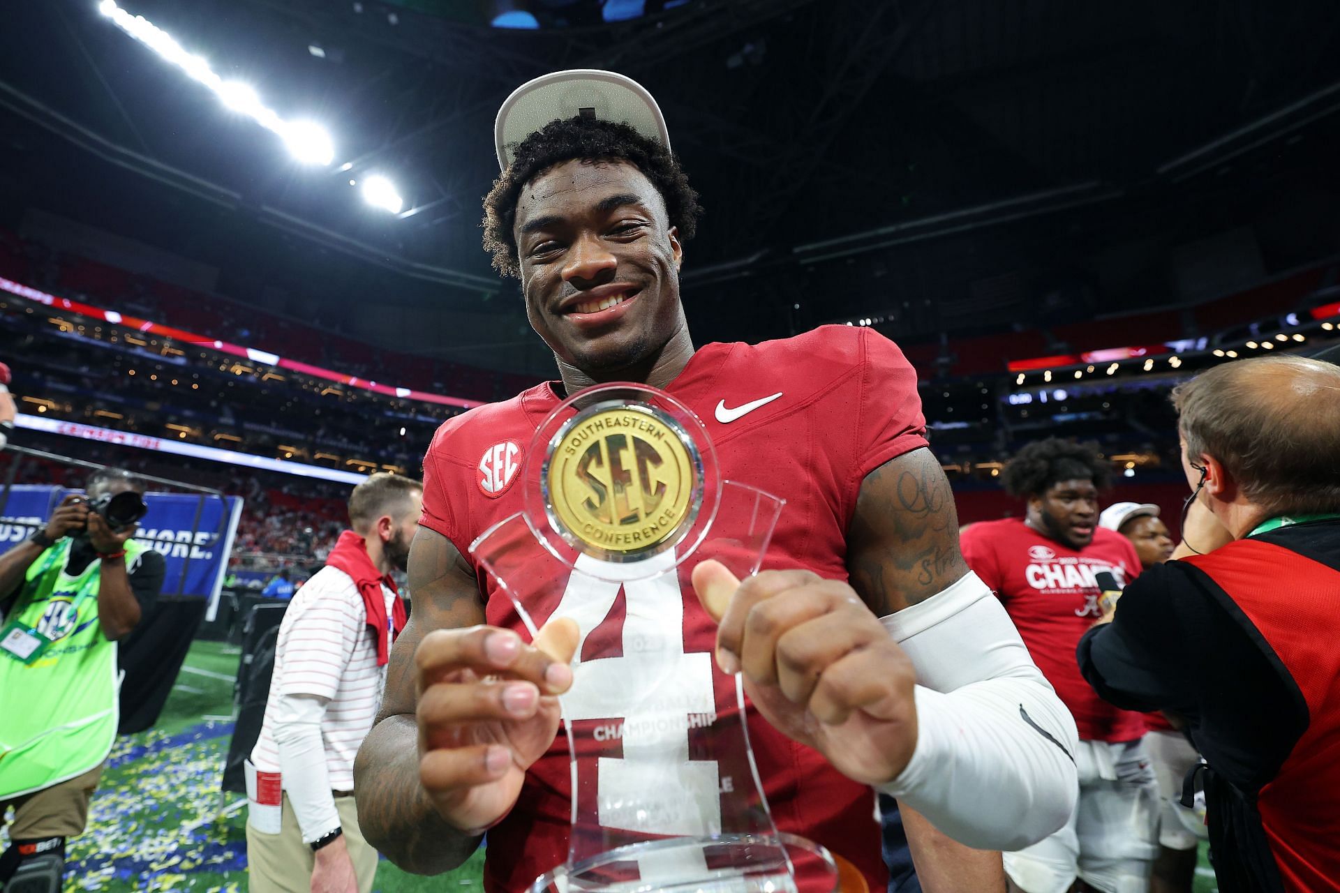 Jalen Milroe #4 of the Alabama Crimson Tide, poses with the MVP trophy