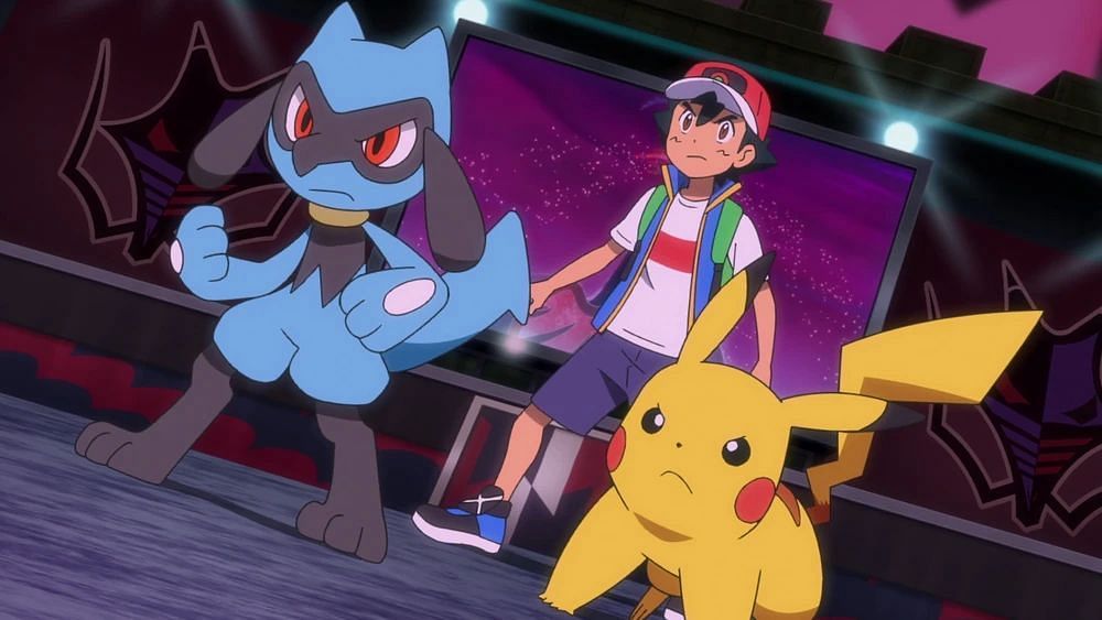 Ash&#039;s Pikachu and Riolu vs Chairman Rose. (Image via The Pokemon Company)