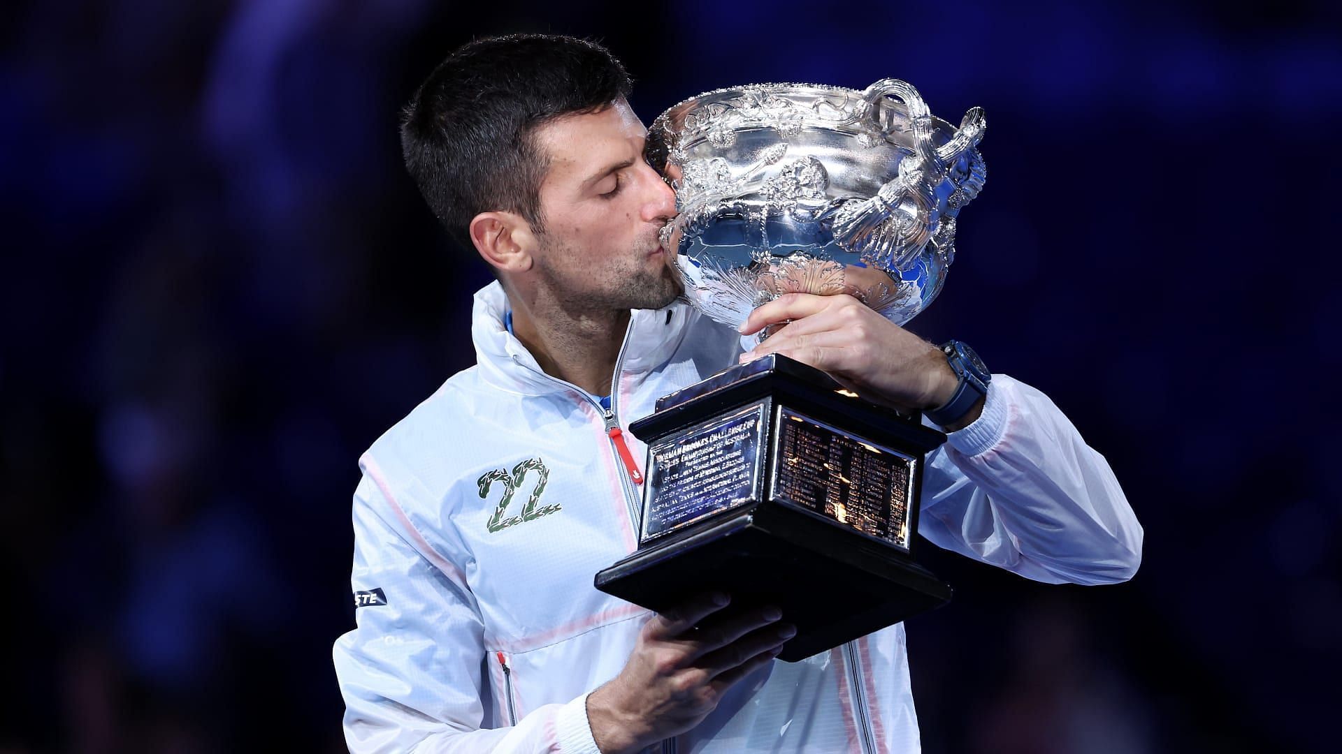 Novak Djokovic poses with the 2023 Australian Open trophy