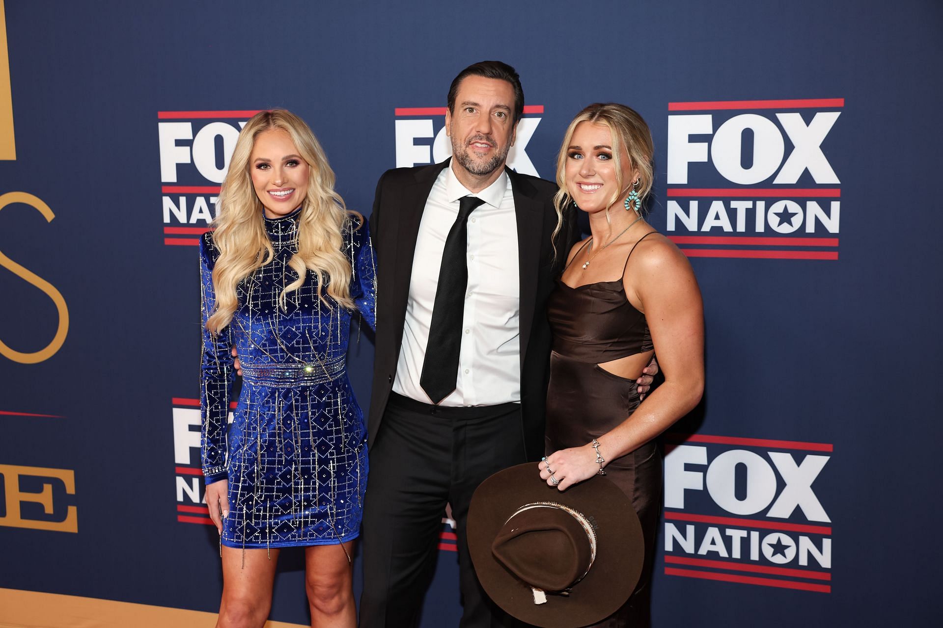 NASHVILLE, TENNESSEE - NOVEMBER 16: Tomi Lahren, Clay Travis and Riley Gaines attend the 2023 FOX Nation Patriot Awards at The Grand Ole Opry