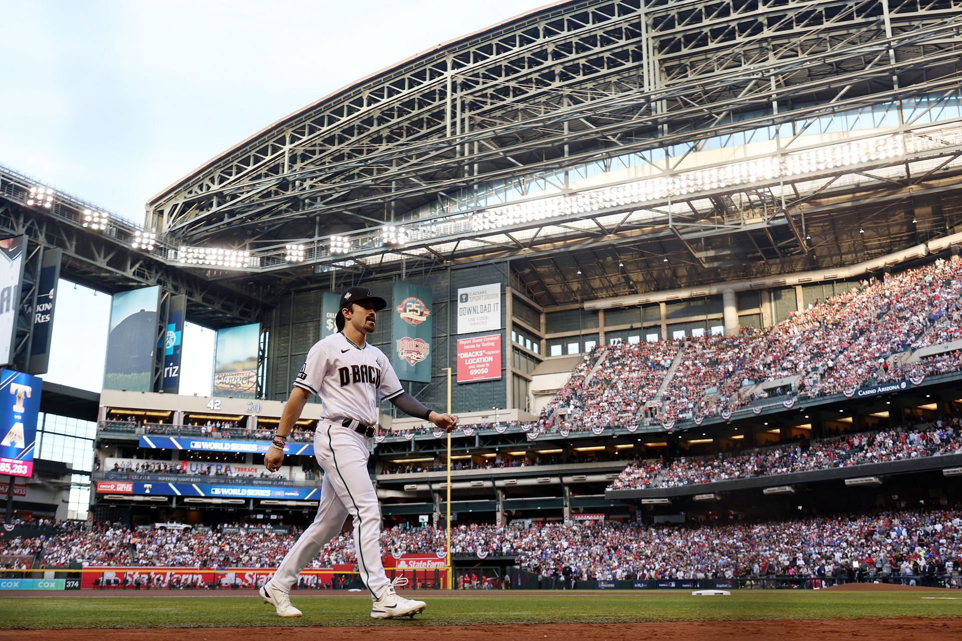 Corbin Carroll #7 of Arizona walks across the field before Game Five of the World Series against the Texas Rangers at Chase Field on November 01, 2023