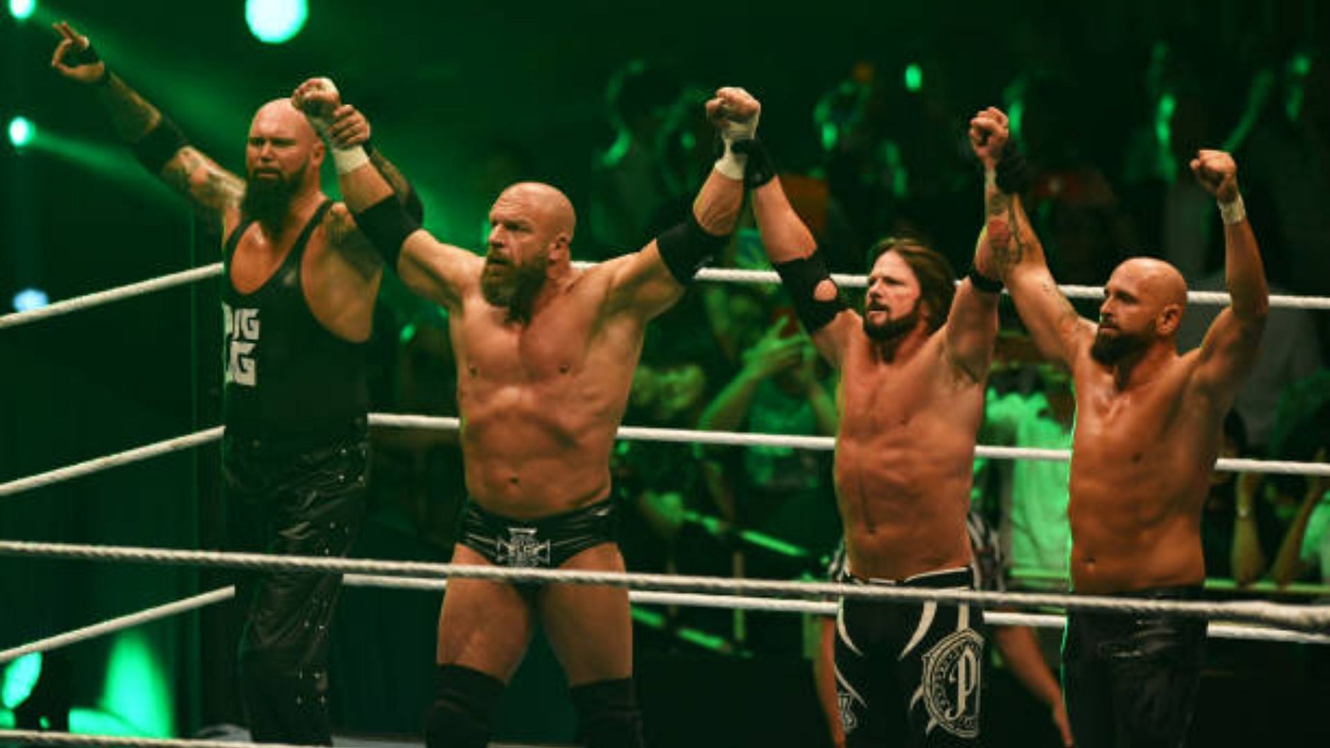 Triple H with AJ Styles and The OC, pictured in 2019