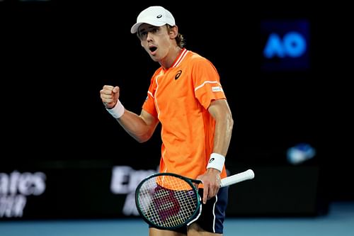 Alex de Minaur celebrates a point against Milos Raonic.