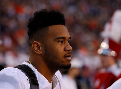 Alabama v Auburn: Tua Tagovailoa #13 of the Alabama Crimson Tide stands on the sidelines during the final seconds of the first half against the Auburn Tigers at Jordan Hare Stadium on November 30, 2019 in Auburn, Alabama. (Photo by Kevin C. Cox/Getty Images)