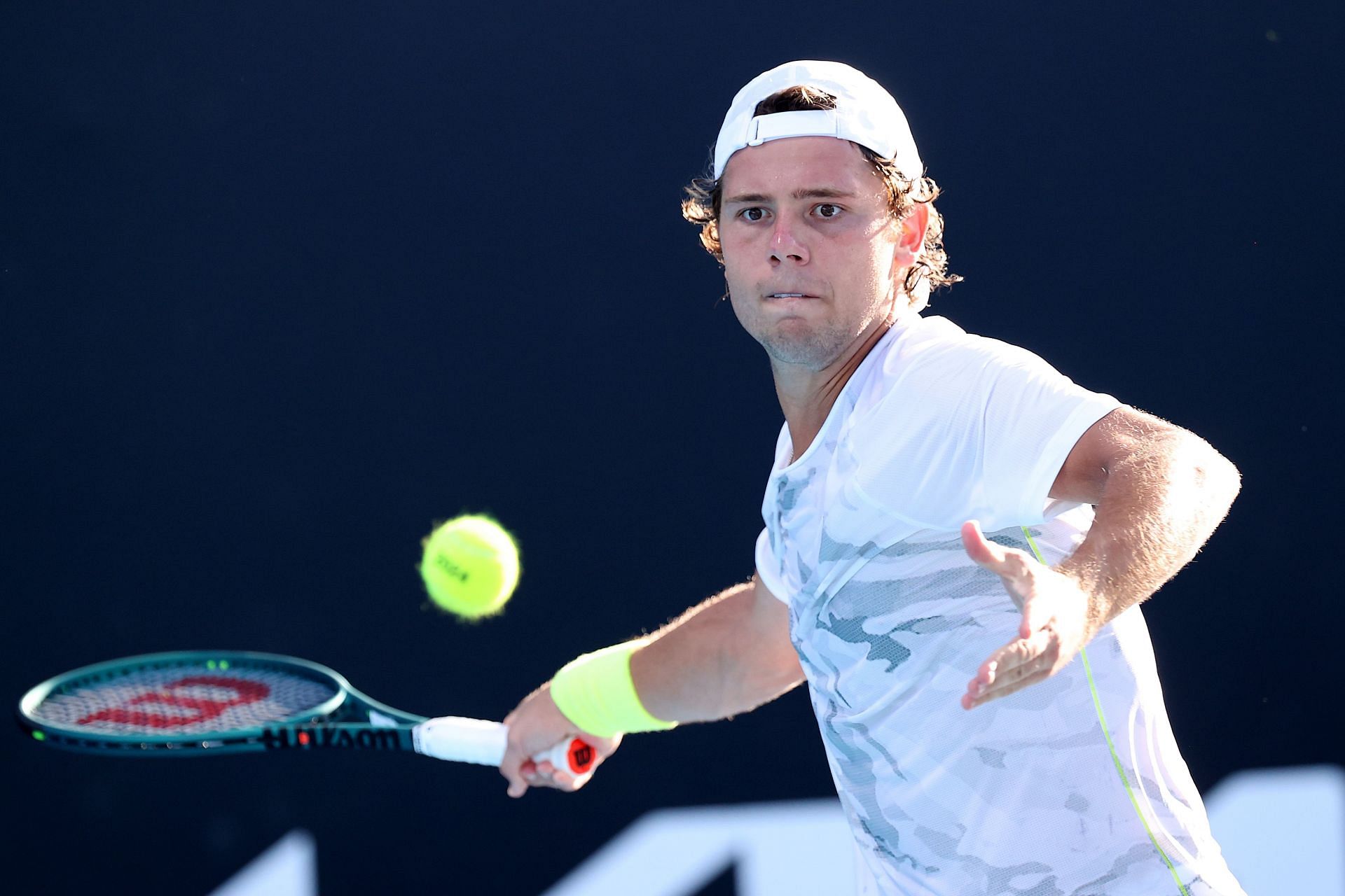 Aleksandar Kovacevic plays a forehand at the Australian Open