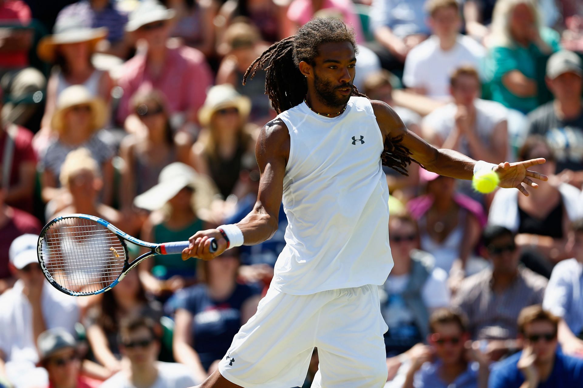 Dustin Brown hits a forehand against Rafael Nadal