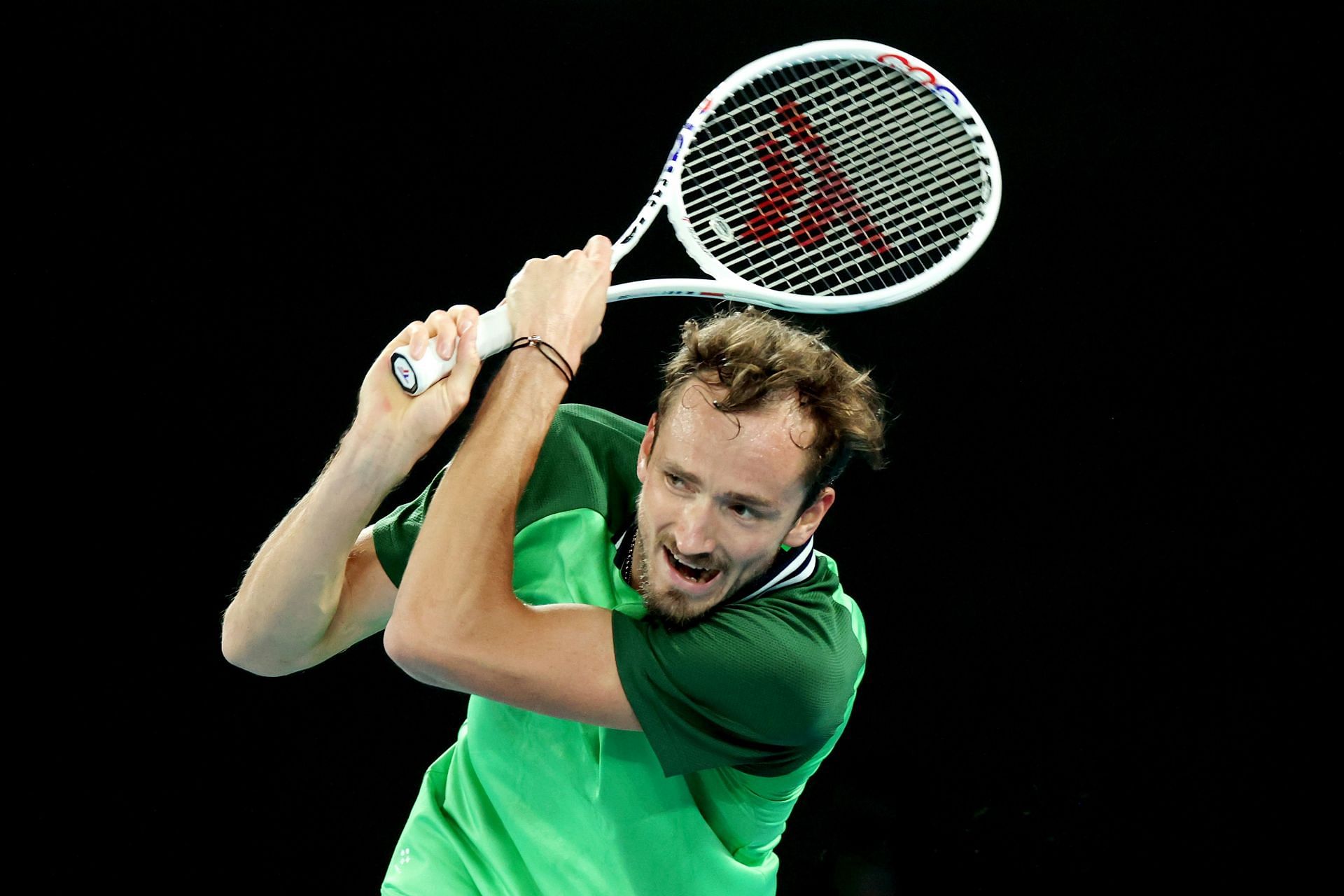 Daniil Medvedev plays a backhand at the 2024 Australian Open