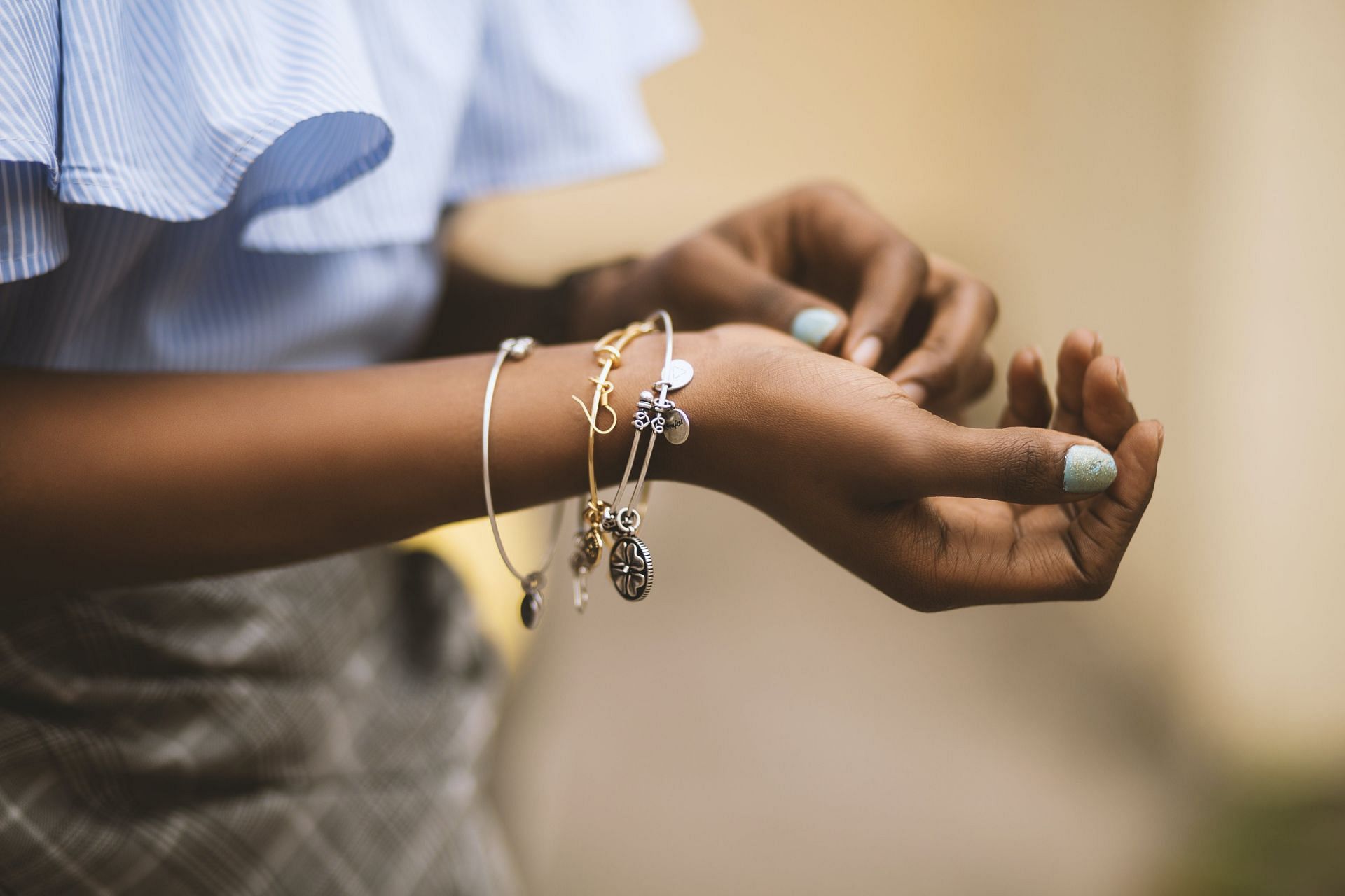 Customize bracelet with charms (Image via Pexels)