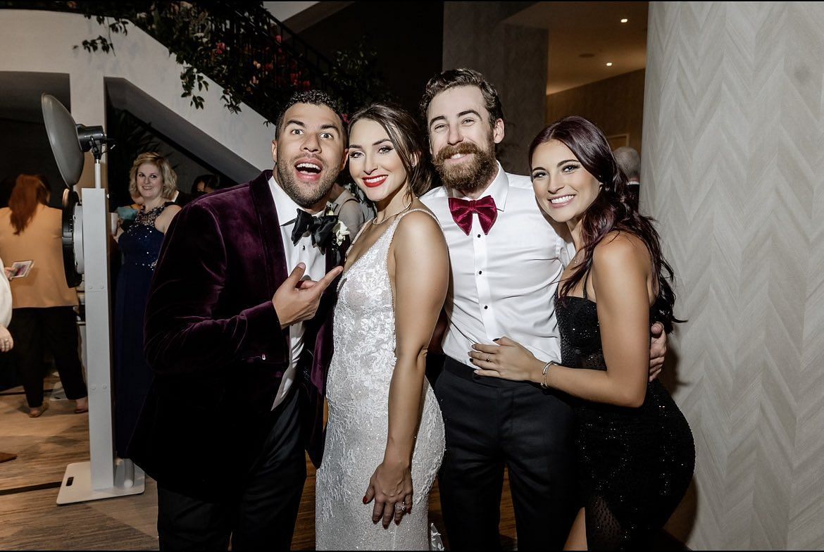 Bubba Wallace and his wife along with Ryan Blaney and girlfriend at the formers wedding in 2022.