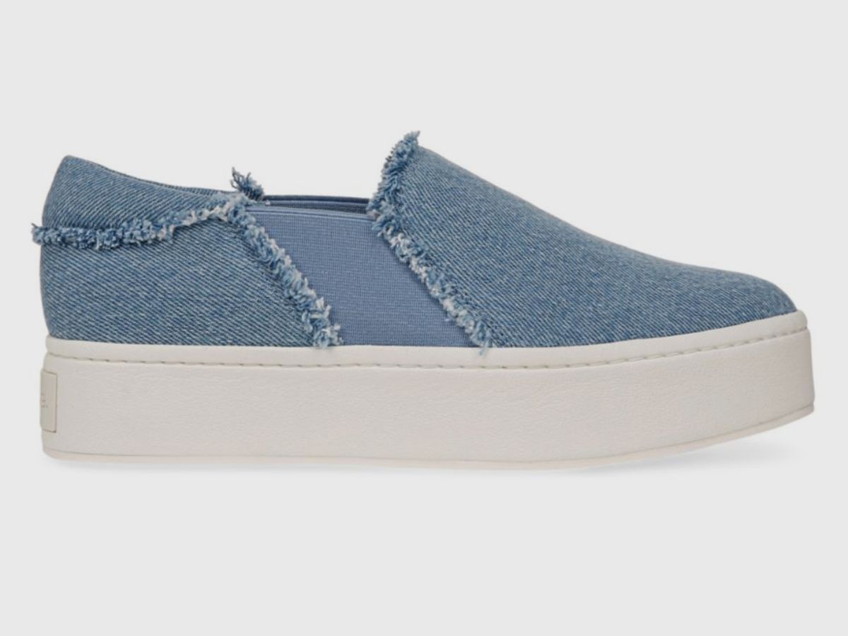 The Waren frayed denim slip-on sneakers (Image via Neiman Marcus)