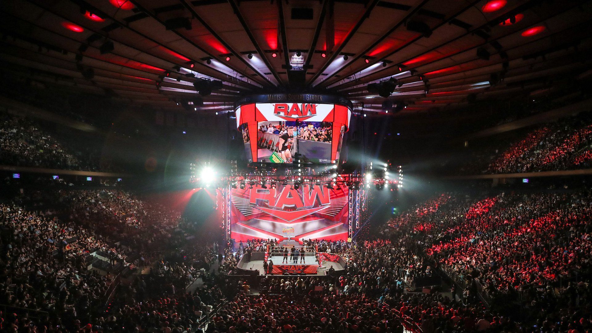 The WWE RAW ring and stage/set inside a packed arena