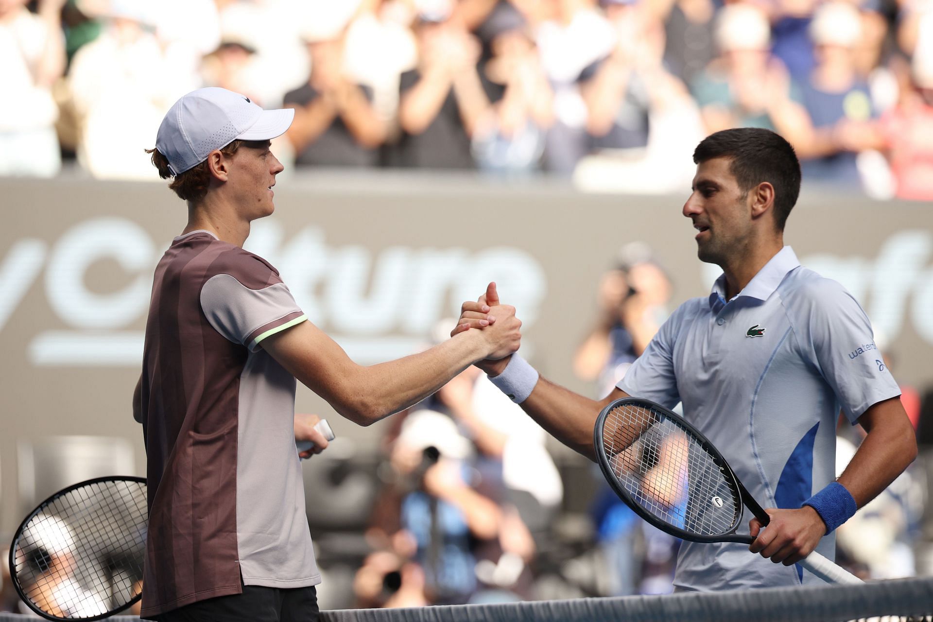 Jannik Sinner shakes hands with Novak Djokovic at the 2024 Australian Open.