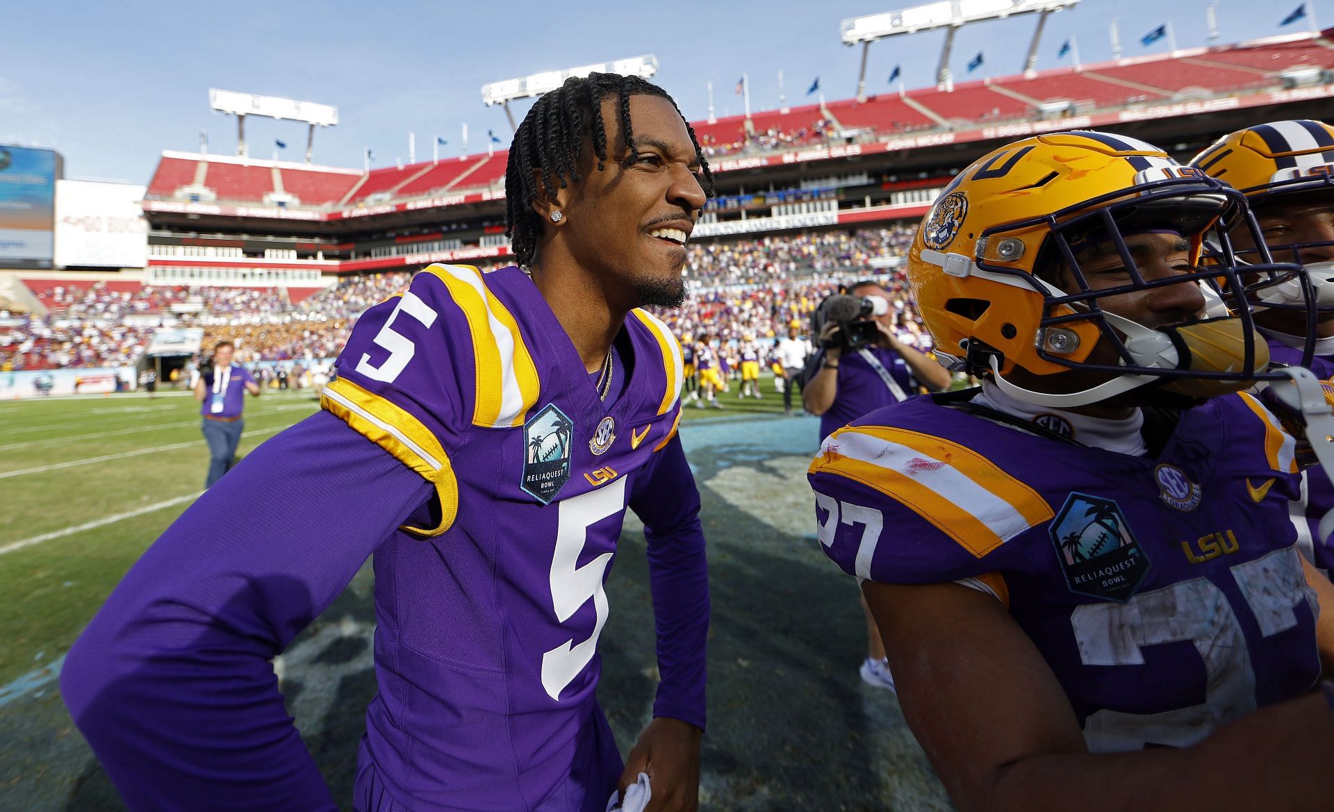 ReliaQuest Bowl - Wisconsin v LSU: TAMPA, FLORIDA - JANUARY 01: Jayden Daniels #5 of the LSU Tigers celebrates after winning the ReliaQuest Bowl against the Wisconsin Badgers at Raymond James Stadium on January 01, 2024 in Tampa, Florida. (Photo by Mike Ehrmann/Getty Images)