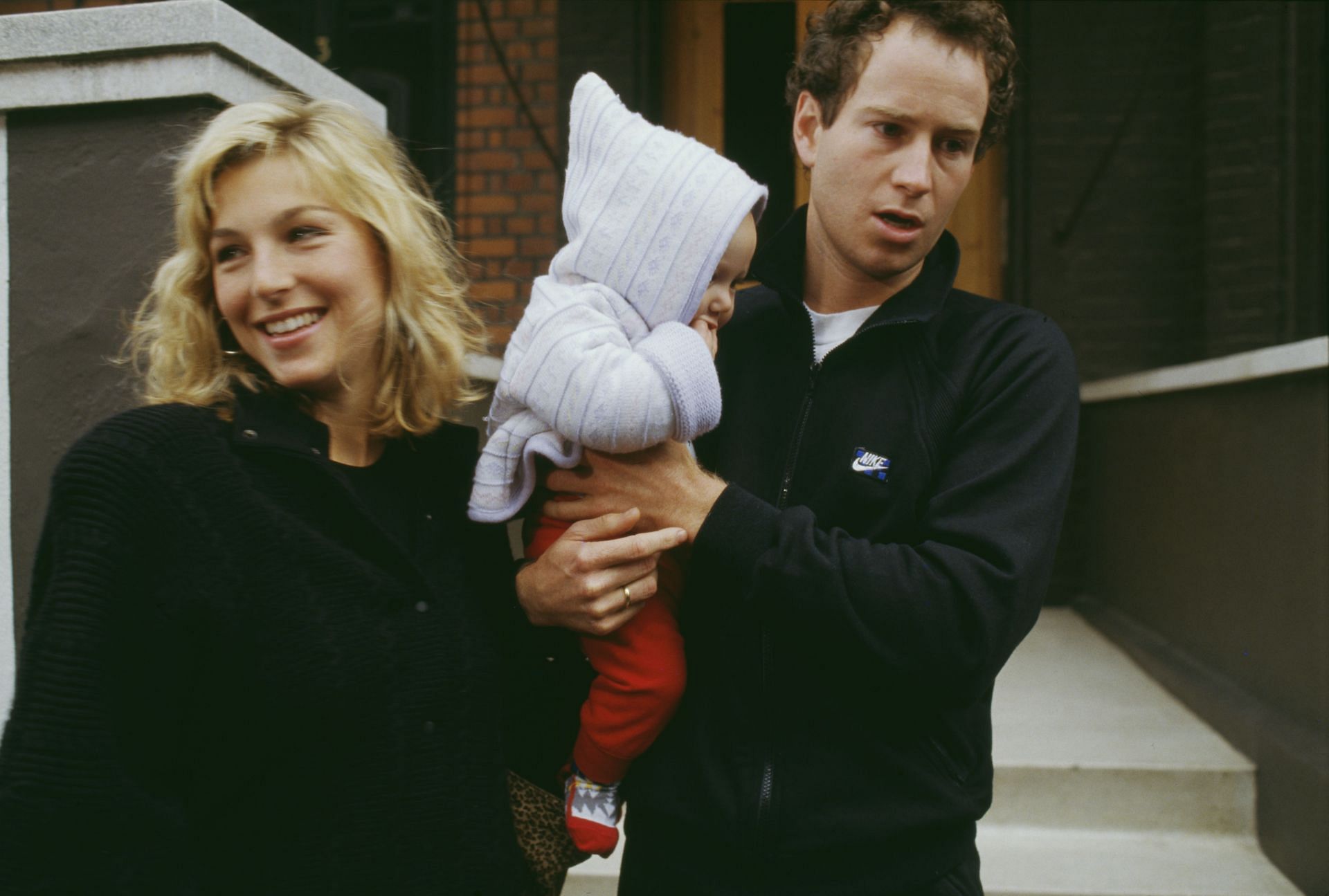 John McEnroe and Tatum O'Neal pictured with their son Kevin in 1987