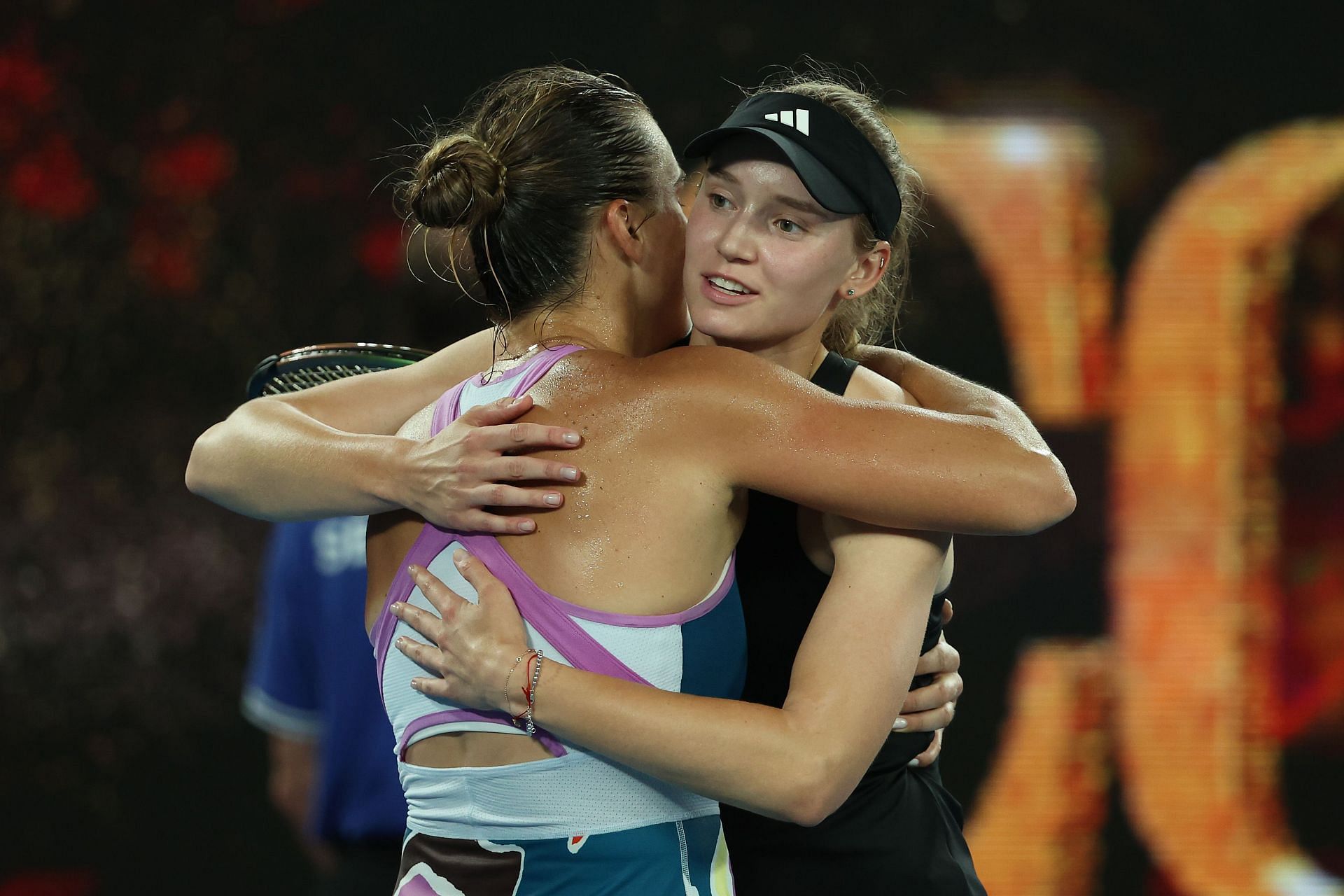 Elena Rybakina (R) hugs Aryna Sabalenka after losing Australian Open 2023 final.