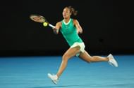 Zheng Qinwen strikes the ball at the 2024 Australian Open.