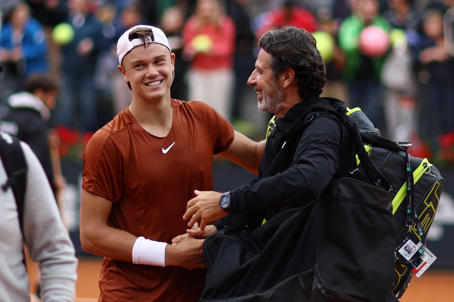 Holger Rune and Patrick Mouratoglou embrace at Italian Open 2023