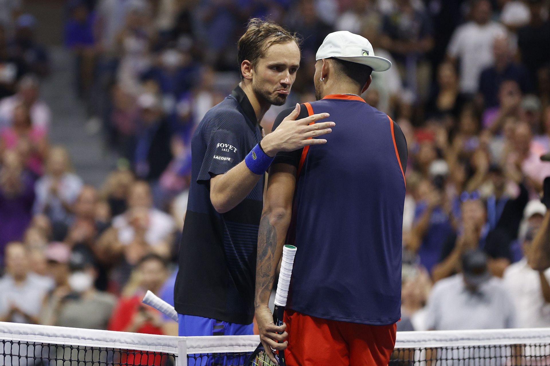 Daniil Medvedev (L) and Nick Kyrgios shake hands