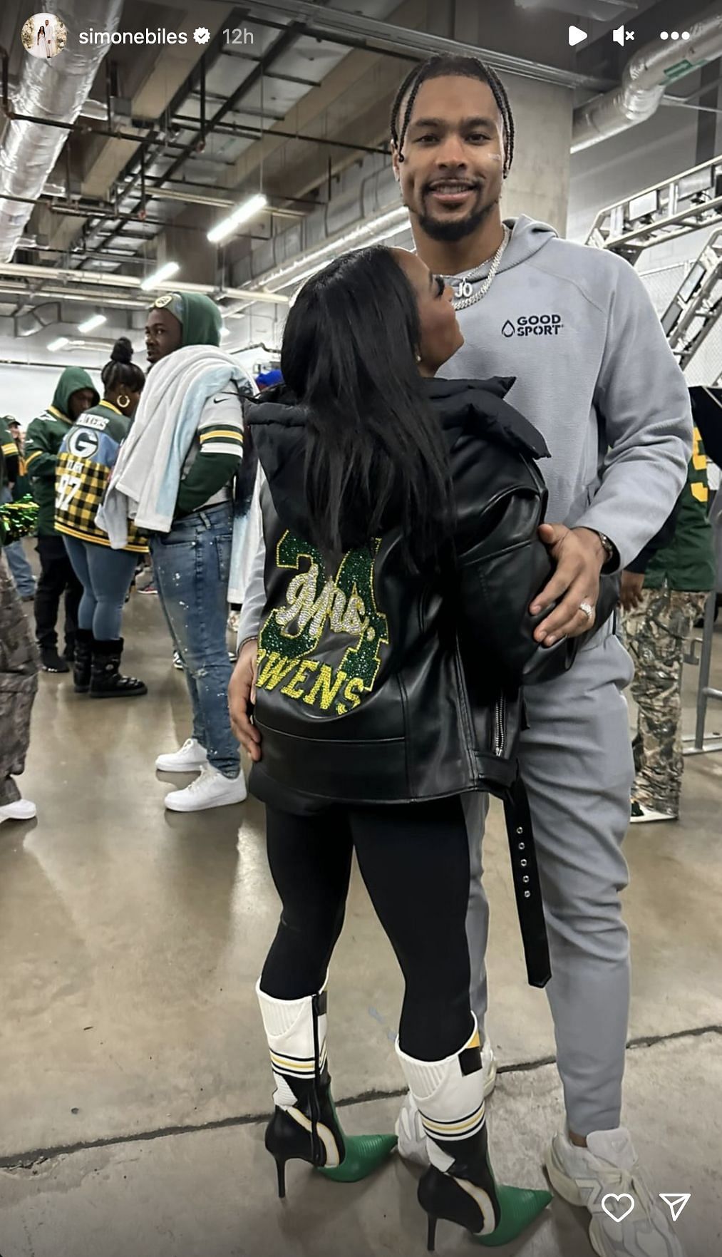 Biles with her husband after the Packers' playoff win